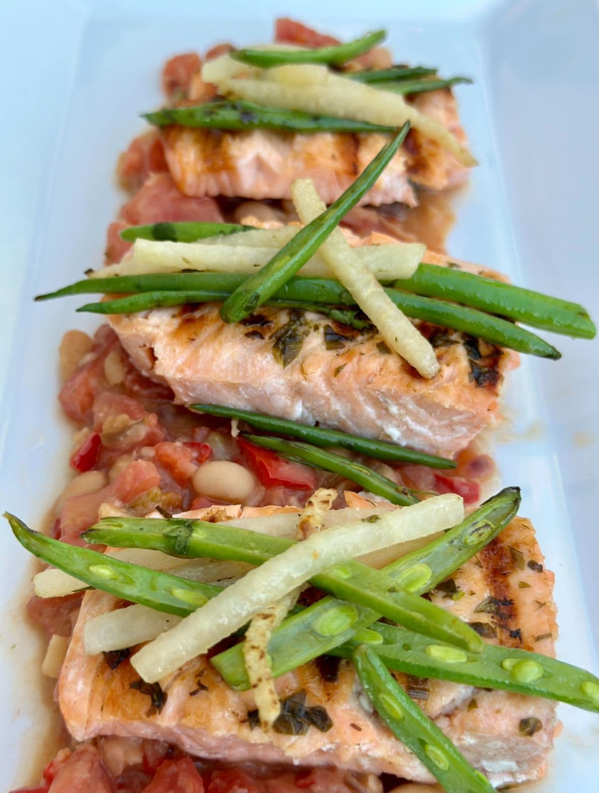 Grilled salmon with a jicama salad (lime cilantro vinaigrette) and white bean stew